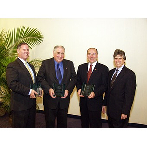 Three College of Business Administration alumni recipients of the Distinguished Service Award with Dr. Ira R. Weiss, Dean of the College of Business Administration