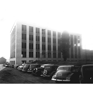 Cars parked in front of the almost completed Mugar Life Sciences Building