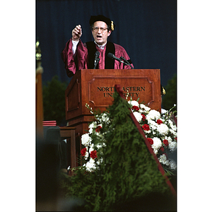 John M. Deutch, 1994 commencement speaker, delivering speech from the podium