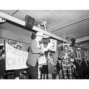 Students in costume speak at a Mayor of Huntington Avenue rally