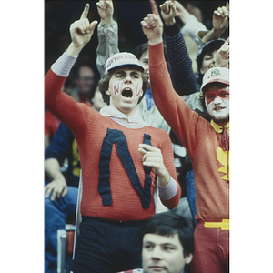 Northeastern basketball fan cheering in the stands