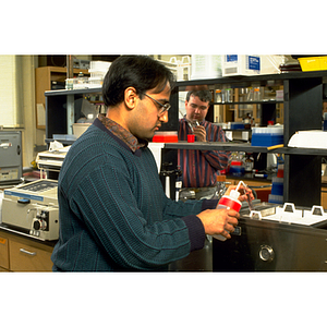 Chemistry students conducting experiments in a laboratory