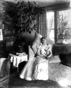 Portrait of Miss Lulu Palfrey, sitting on a couch in the morning room, facing front, Arthur Little House, 2 Raleigh St., Boston, Mass., undated