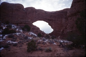 Sandi Sommer, from a distance, standing under a large arch formation