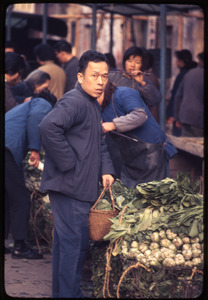 Man at vegetable stand