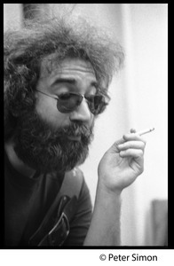 Jerry Garcia: portrait close-up, smoking a cigarette