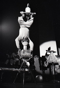 Chimpanzee vaudeville act opening for the Grateful Dead at Sargent Gym, Boston University: chimpanzee balancing upside-down with parrot