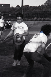 Boston Phoenix vs. WBCN staff softball game: Danny Schechter holding hat and running home