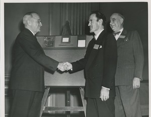 Harry S. Truman shakes Mr. Tufan's hand while Colonel John N. Smith looks on