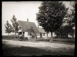 Automobile in front of a Greenwich Plains house, last owned by Cassie Crane