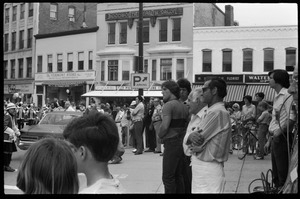 Crowd watching a drill team perform, corner of Main Street and Crafts Ave.