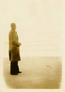 Leon M. Smith standing on beach