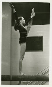 Joan Carey performing on the balance beam, 1982