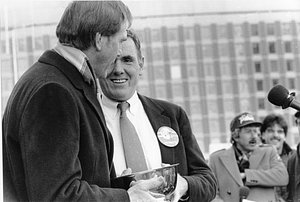 Mayor Raymond L. Flynn presenting a bowl to New England Patriots coach Raymond Berry at celebration for New England Patriots 1985 team