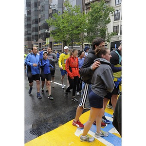 At the Copley Square finish line, many participants complete the "One Run"