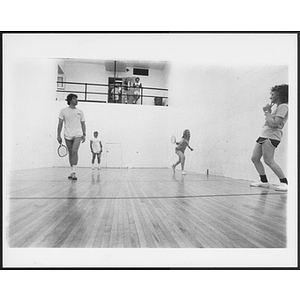 Two racquetball teams in a game of doubles