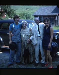 Steven Masters (Class of 1975), Ella Rosenburg, Arthur Rosenburg, and Charmaine Masters (left to right) preparing to leave Sunnybrook Farm on Sheep Hill to attend the Moon Barn Raising at entrance to Hopkins Forest on 2 August 1975.