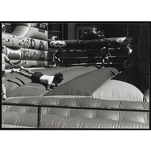 Children play on an inflatable at a carnival