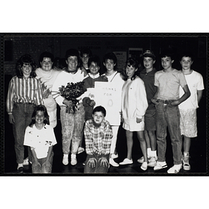 Several youth and adults pose for a group photo