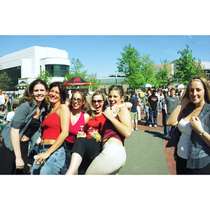 Female students pose together in Centennial Quad during Springfest activities