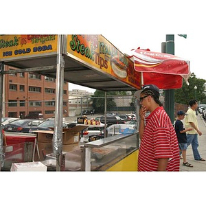 Danny Vazquez at a food stand outside Fenway Park