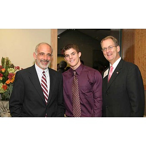 Joseph Bordieri poses with two men at the Torch Scholars dinner