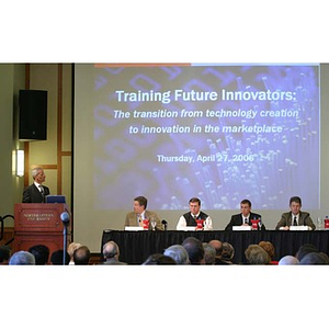 The panelists and projection screen at the Training Future Innovators Entrepreneurs Panel