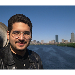 Co-op student standing in front of the Boston skyline