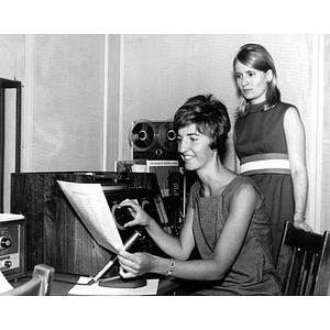 Deaf Institute Teachers Karen A. Deheeuw and Mrs. Diane Williams working with equipment at the institute