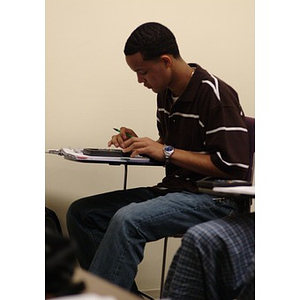 Odalis David Polanco works on an assignment in class