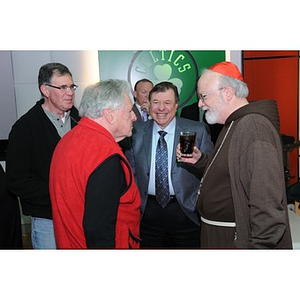 Guests talking at a Beanpot Reception