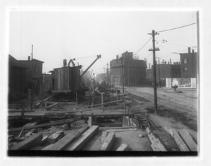 View of construction showing wood beams and a crane