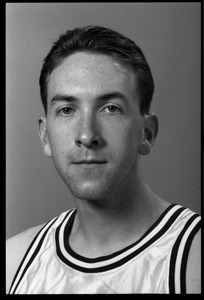 Jason Germain: studio portrait of senior guard with UMass Amherst basketball team