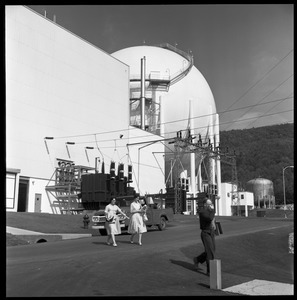 Yankee Atomic: workers leaving the plant, with parked truck and spherical containment building in background