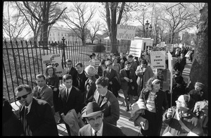 Protesters outside the White House marching against the war in Vietnam, carrying signs reading 'Clergy for peace in Vietnam,' 'University of Virginia,' and more: Washington Vietnam March for Peace