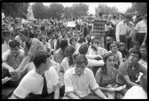 Anti-Vietnam war protesters sitting down after Assembly of Unrepresented People peace march