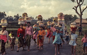 Women and girls carrying offerings