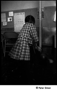 Young girl playing in the classroom at the Liberation School