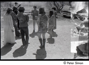 May Day at Packer Corners commune: double exposure of bonfire and group circle, Michael Gies facing camera