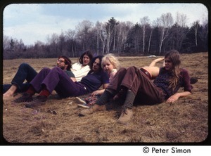 Group lounging on the grass at May Day, Tree Frog Farm commune