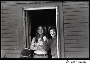 Richard Wizansky (right), Ellen Weiss, and other communards looking of a doorway, Tree Frog Farm commune