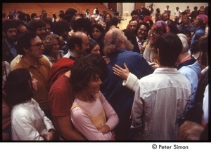 Ram Dass speaking with a group after a lecture at Boston University