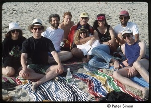 Sharon Salzberg (left), Sam Harris, Daniel Goleman, Hanuman Goleman, Ram Dass, Susan Harris, Tara Bennett-Goleman, Tom Lesser, Joseph Goldstein posing on the beach