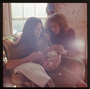 Nina feeding baby (Eben), with Charles Light, Montague Farm Commune