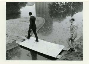 Robert C. Wood walking at campus pond