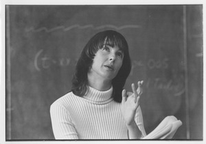 Dr. Alice H. Eagly standing in front of chalkboard, speaking