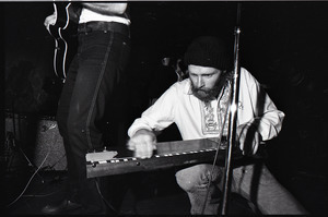 Beach Boys at Boston College: Mike Love kneeling with keyboard