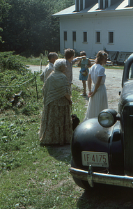 Arthur E. and Ella M. Rosenburg, Henry Art, unidentified, and Charmaine Masters (left to right) at the Carriage House at beginning of the Moon Barn Raising at entrance to Hopkins Forest on 2 August 1975.
