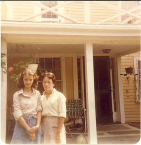 My friend and me in front of my childhood house