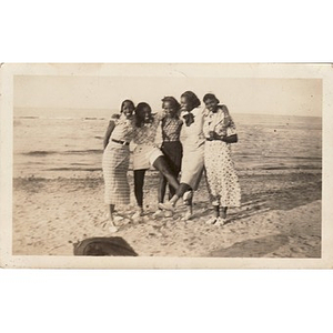 Inez Irving and her friends pose together on the beach